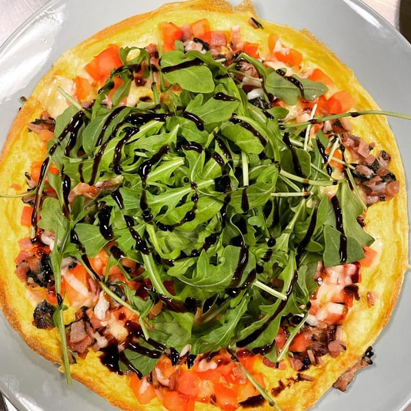 Market Street Grill's omelet with tomatoes, bacon, cheese, arugula, and balsamic glaze.