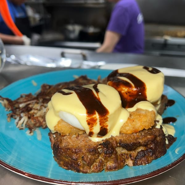 Market Street Grill's meatloaf benedict with hash browns, topped with hollandaise and BBQ sauce.